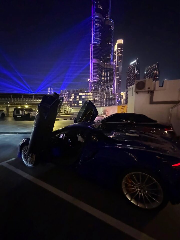Supercar parked below the Burj Khalifa light show