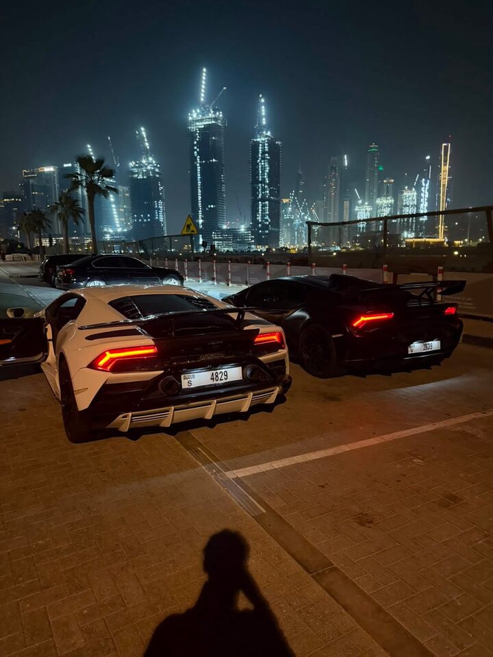 Supercars parked at night in Dubai