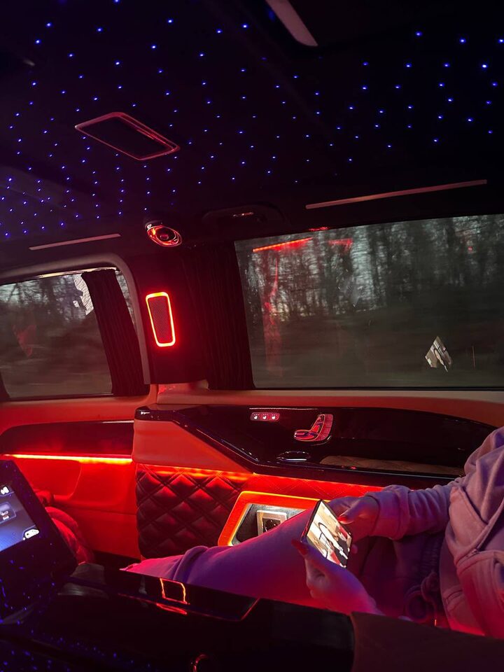 Interior of a chauffeured car at night